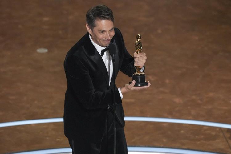 Sean Baker wins original screenplay Oscar for 'Anora.' 'Conclave' wins adapted screenplay trophy