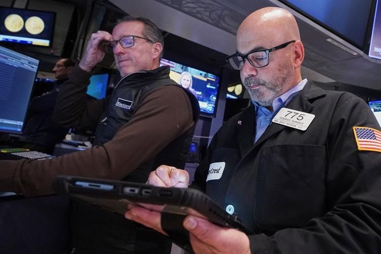 Wall Street swings through another unsettled day ahead of a crucial couple of tests