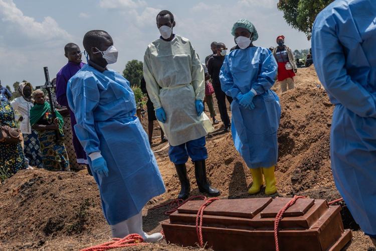 Mourners bury a 6-month-old Ebola victim, marking third orphanage death as Congo outbreak spreads