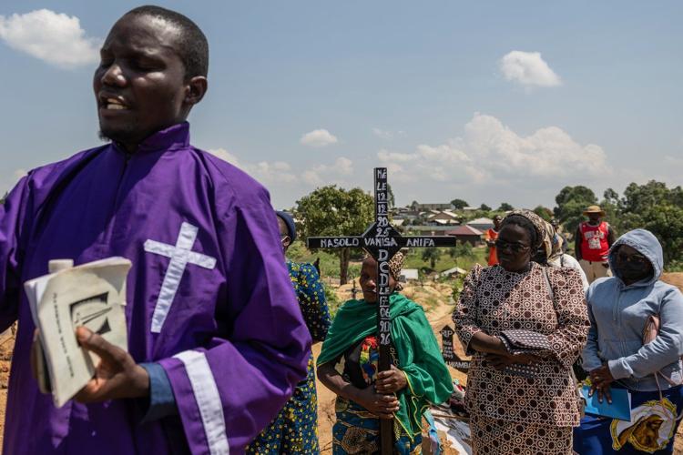 Mourners bury a 6-month-old Ebola victim in the Congo outbreak's 3rd orphanage death