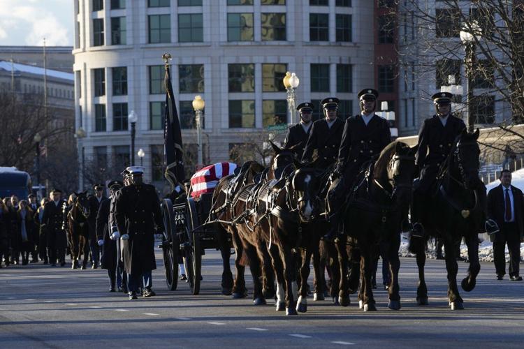 Jimmy Carter's casket arrives at the US Capitol, where he will lie in state