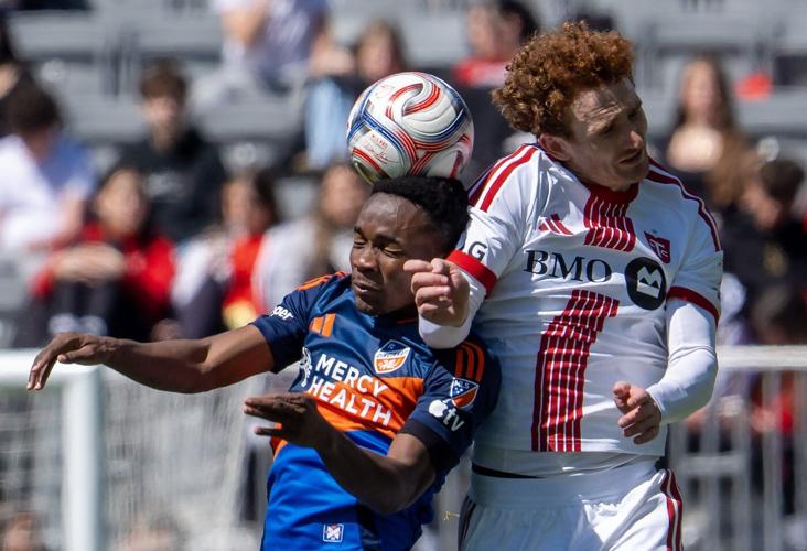 Short-handed Cincinnati score late to salvage 1-1 draw with Toronto FC