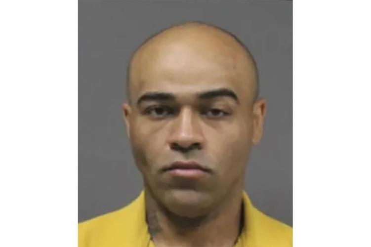 Man wanted on murder charges is apprehended at Chicago restaurant just blocks from DNC