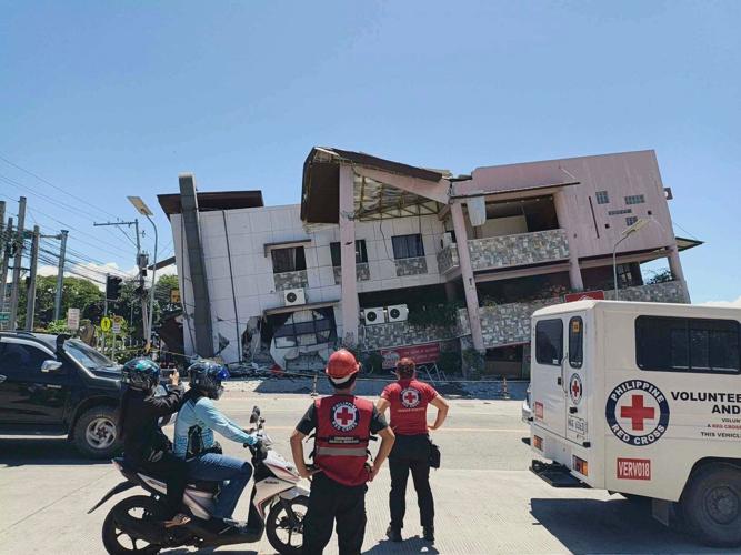 A 7.8 magnitude quake kills 12, destroys buildings and sparks tsunami in southern Philippines