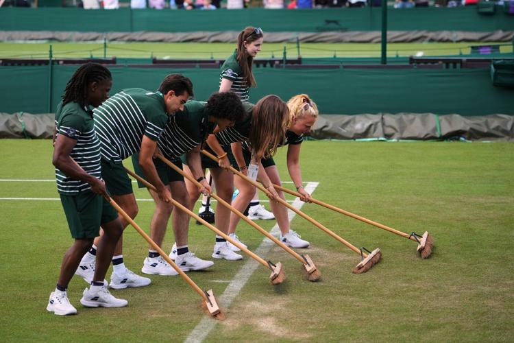 Wimbledon kept its courts lush green as other London lawns browned in record heat
