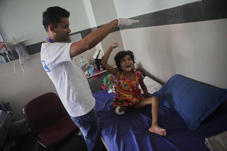 2 girls survived Nepal's 2015 earthquake. Each lost a leg, but found friendship in the hospital