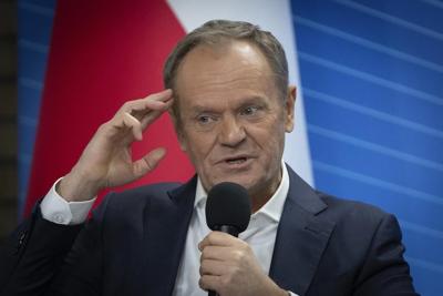 Poland's pro-EU government and opposition disagree on whether 2 pardoned lawmakers can stay on