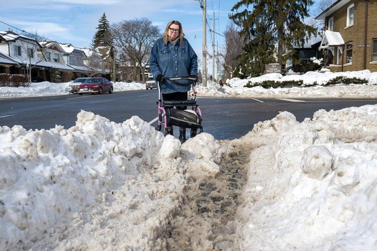 People with mobility issues struggle to navigate sidewalks as cities rush to clear snow