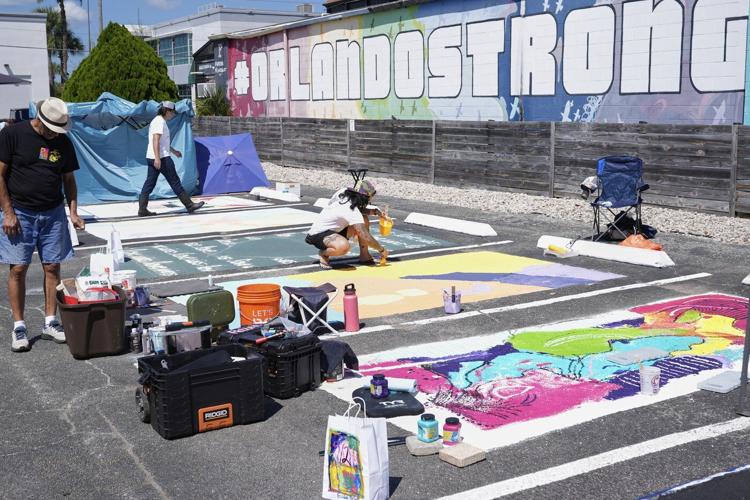 Parking spots used as colorful protest against Florida crackdown on rainbow crosswalks