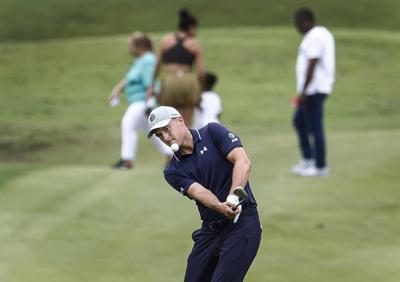 Jordan Spieth keeps a clean card in the mud for a 63 to lead the PGA Tour playoff opener