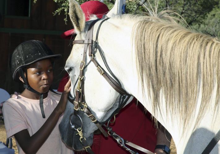 A horse therapy program in Namibia brings joy to children with learning disabilities