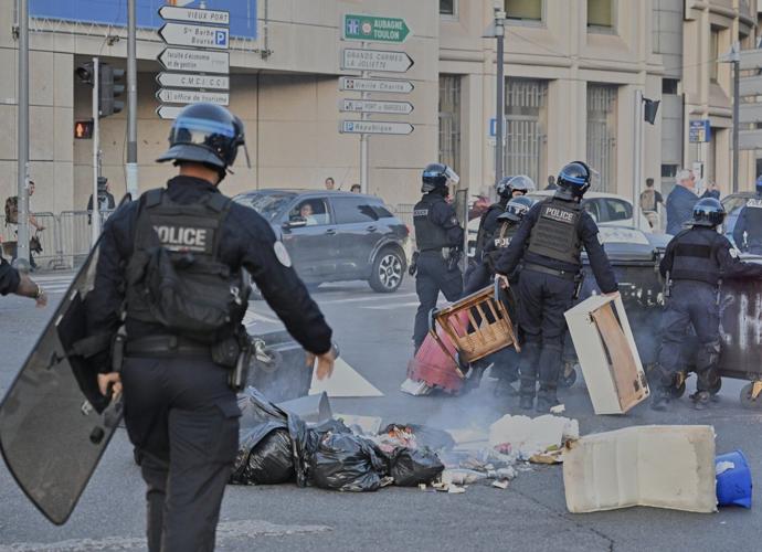 Protesters block roads and start fires across France to challenge the new prime minister, in photos