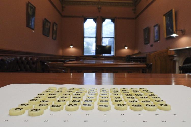 In New Zealand's Parliament, a battered cookie tin decides which new laws get debated