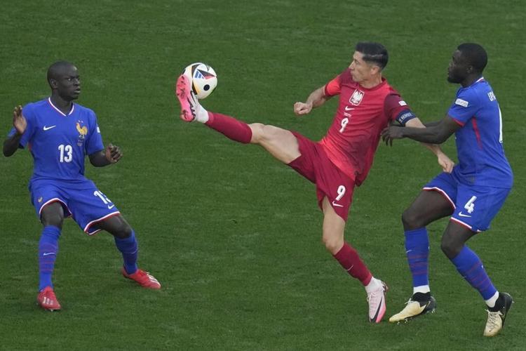 Kylian Mbappé scores on return from broken nose and France draws 1-1 with Poland at Euro 2024
