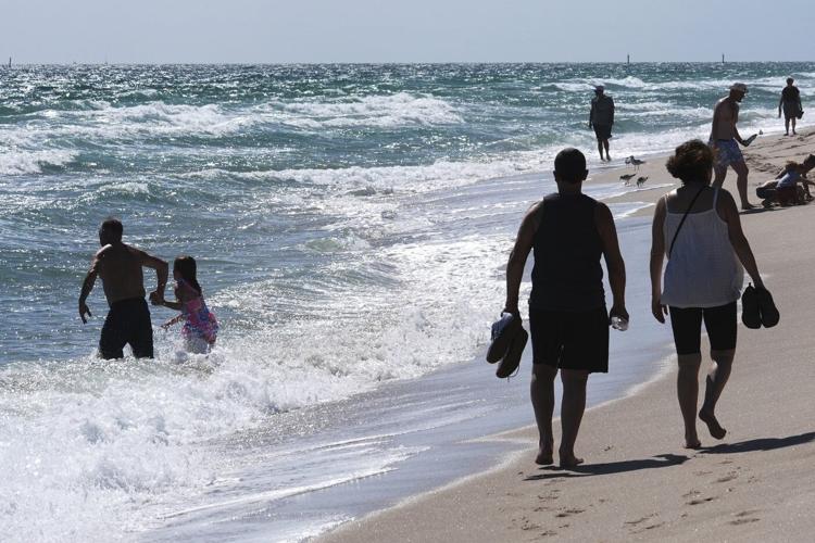 Tar balls wash ashore on Florida beaches, but the source of the sticky black goo is a mystery