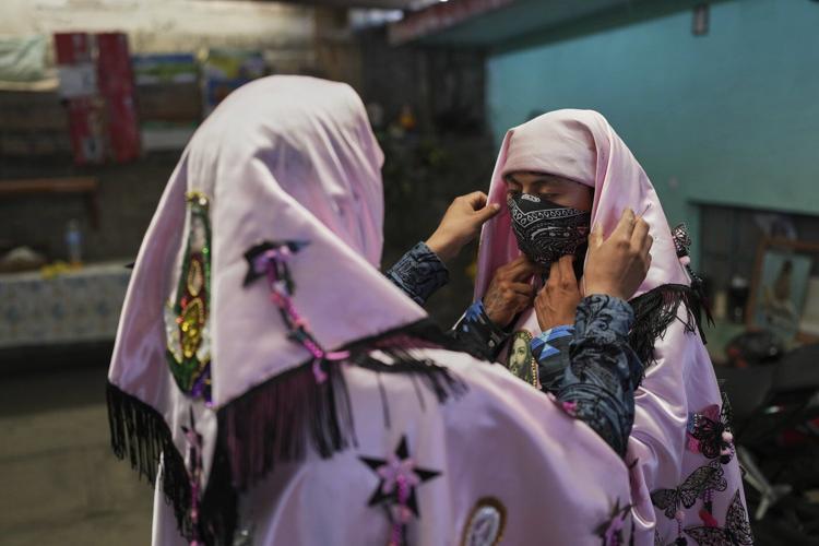 Easter is celebrated with giant caterpillar-like hats and flames in this Mexican town
