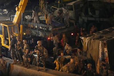 Bullets hit Lebanese defense minister's car as he was on the road near Beirut but no one was hurt