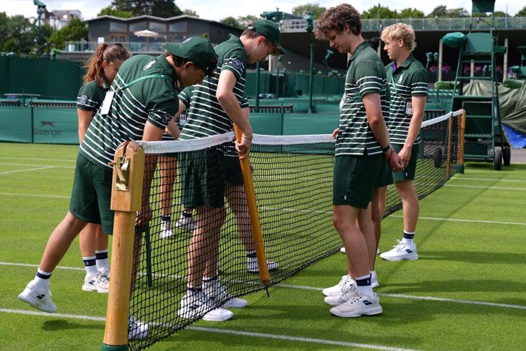 Wimbledon kept its courts lush green as other London lawns browned in record heat