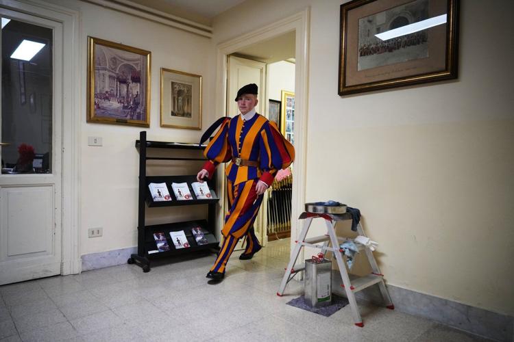 A look at Swiss Guards preparing for a swearing-in ceremony attended by the Pope, in photos
