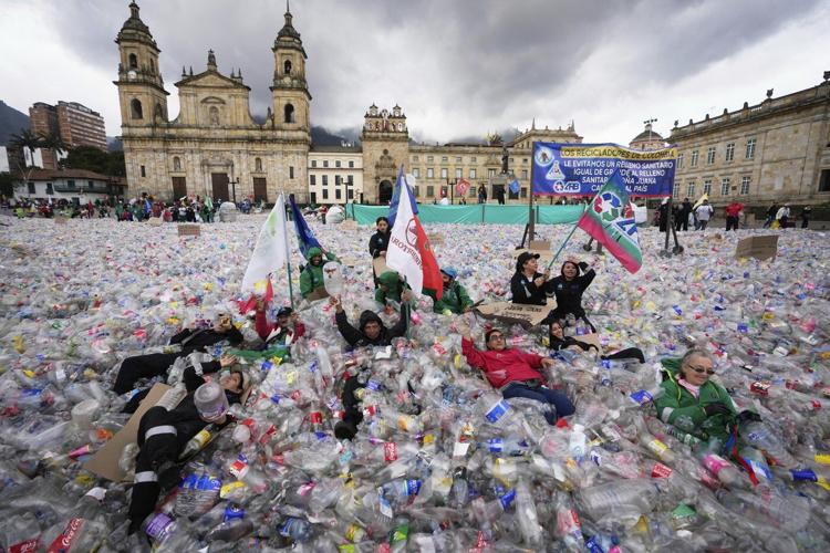 Colombian waste pickers inundate iconic Bogota square with plastic bottles to protest falling wages