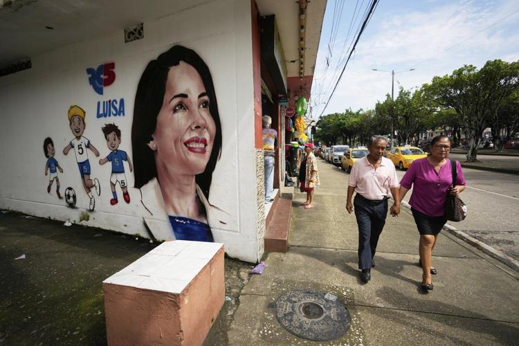 Polls open in Ecuador's presidential runoff as voters choose between incumbent and a leftist lawyer