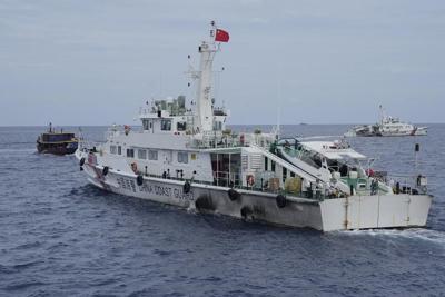 Philippines says it will remove any barrier China installs in the disputed South China Sea