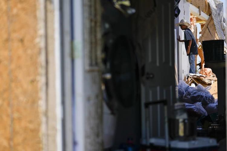 In a north Texas county, dazed residents sift through homes mangled by a tornado