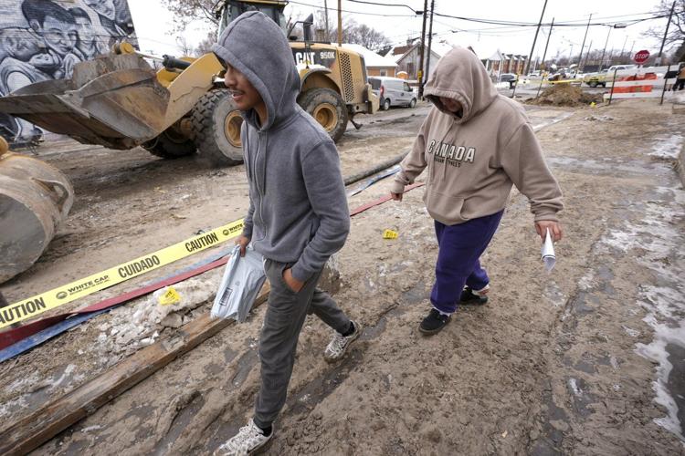 Detroit crews are working to fix a broken water main that flooded dozens of homes