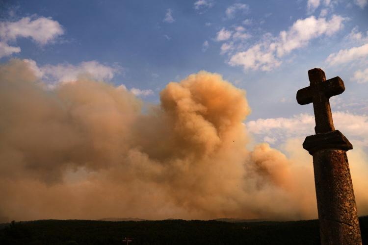 Firefighters battle one of Spain's biggest-ever wildfires during heat wave across the Mediterranean