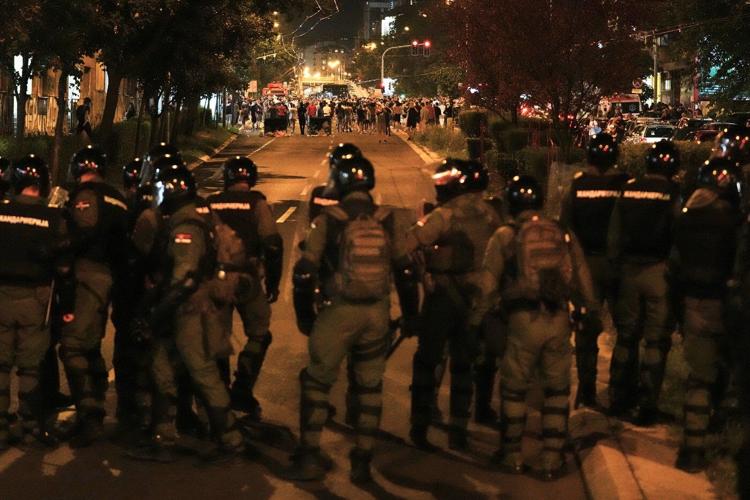 Police chase anti-government protesters in Serbia as president pledges crackdown