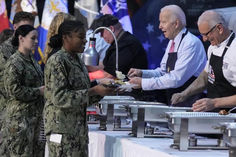 The Bidens start Thanksgiving early by serving dinner and showing 'Wonka' to service members