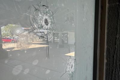 Suspect in shootings of Democratic office in Arizona had over 120 guns in his home, officials find