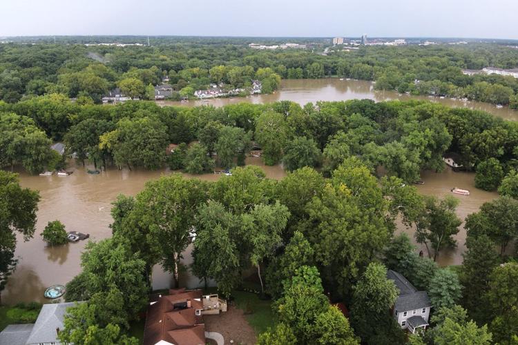 At least 6 people have died from days of storms and record-setting flooding in Indiana