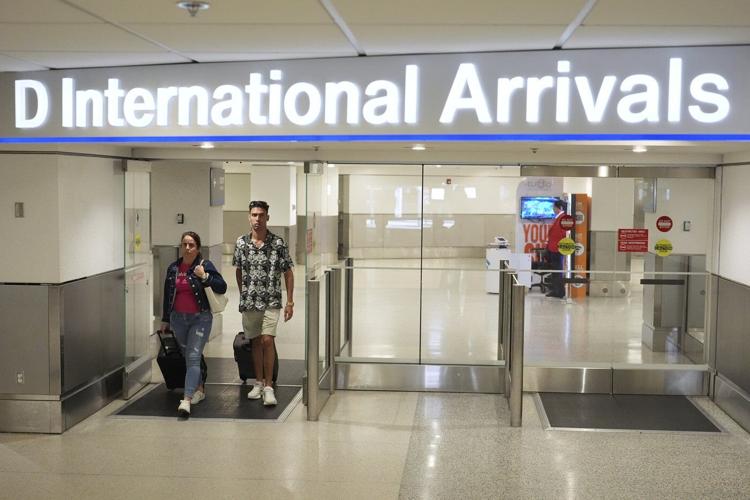 Trump's new travel ban takes effect as tensions escalate over immigration enforcement