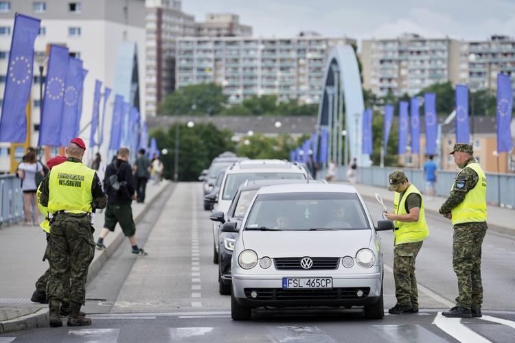 Poland reinstates border controls with Germany and Lithuania to discourage asylum-seekers