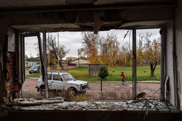 Photos show Ukraine's historic center in ruins but children, athletes still train ahead of Olympics