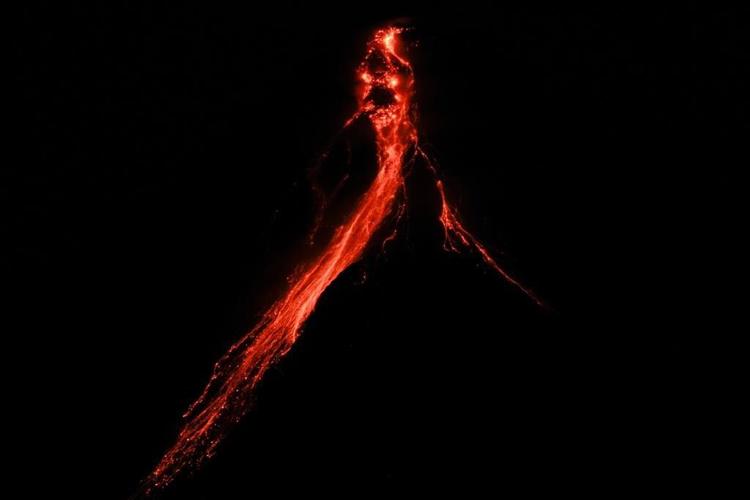 Philippine volcano spews lava in gentle eruption, more villagers asked to brace to evacuate