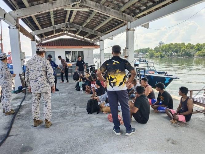 Malaysia searches for 14 missing Indonesians after a migrant boat sinks