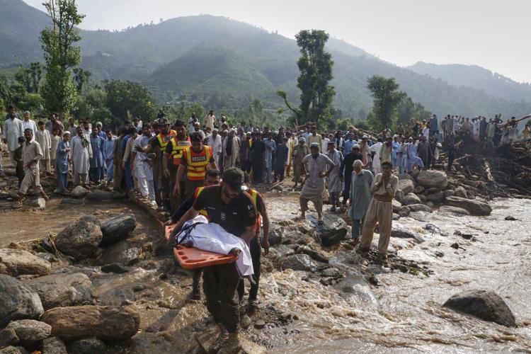 Photos of mourners and searches for the missing from flash floods in Pakistan and India