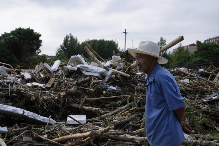 Heavy rain causes flooding, evacuations and at least 38 deaths around Beijing region