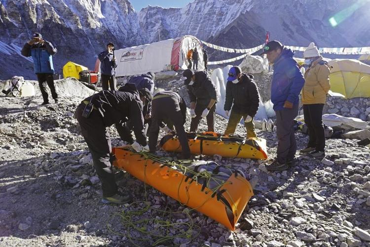 Mount Everest's highest camp is littered with frozen garbage, and cleanup is likely to take years