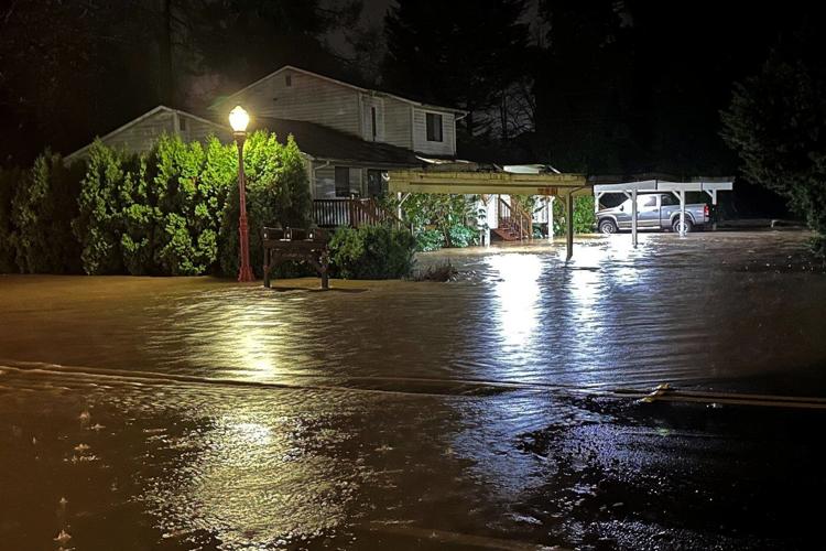 Tens of thousands ordered to flee flooding after torrential rain in Pacific Northwest