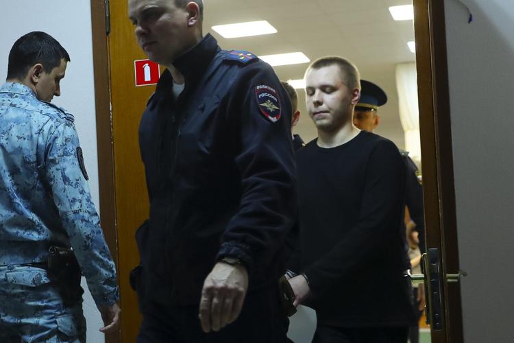 A Russian charged with sending video of military equipment to Ukraine gets 14 years in prison