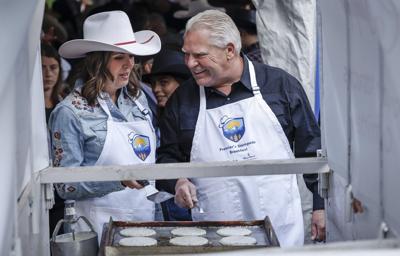 Alberta's Smith to host Calgary Stampede breakfast after mixed reception at parade