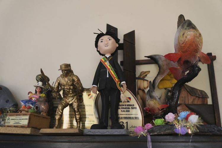 Blocked from Bolivia's election, ex-leader Morales not sure how to respond to threats of arrest