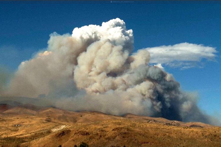 Firefighters are trying to stop a fast-moving Nevada wildfire from spreading to homes in Reno