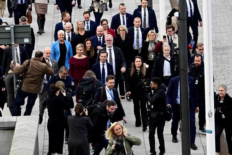 New Swedish PM presents 3-party center-right government