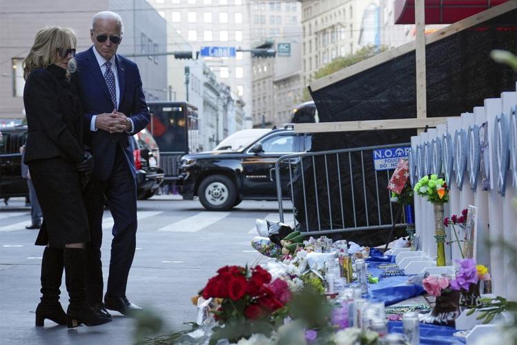 Biden tells New Orleans mourners they are not alone as he honors victims of attack