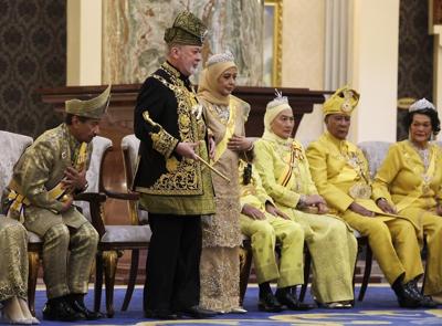 Malaysia honors a new king in coronation marked by pomp and cannon fire