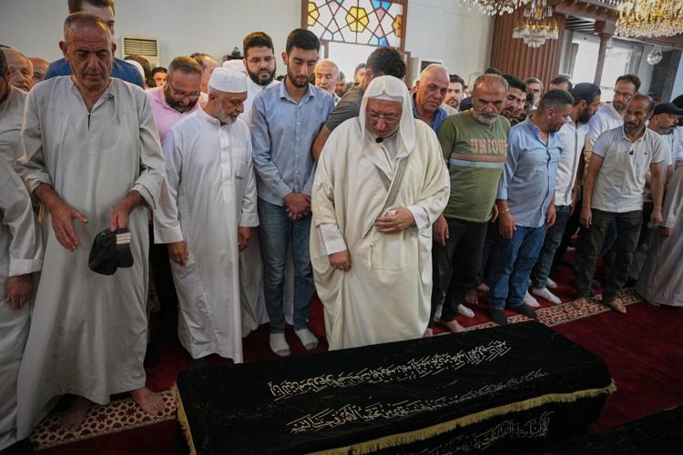 Mourners in Damascus bury cafe blast victims as officials promise justice